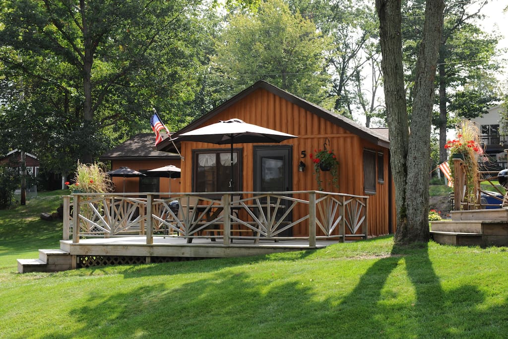 lake front log cabin with a great deck